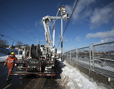 Electrical engineers performing maintenance and upgrading equipment