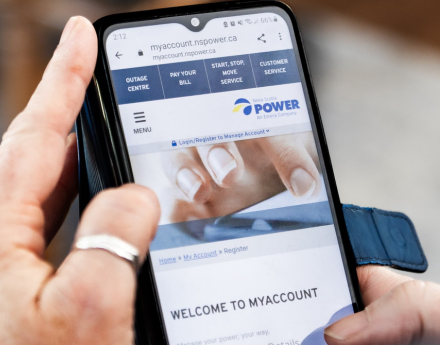 A person holding a smartphone viewing myaccount