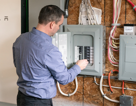 man-looking-at-open-service-panel