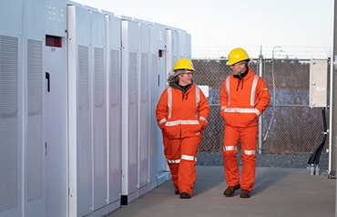 workers-in-hard-hats-safety-coveralls workers-in-hard-hats-safety-coveralls