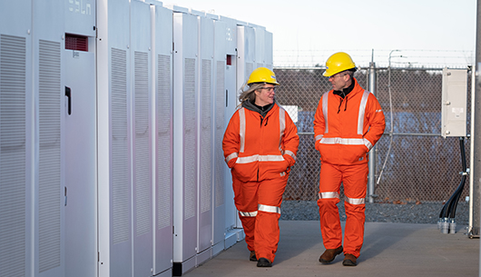 workers-in-hard-hat-safety-coveralls